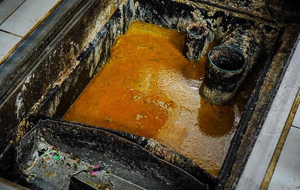 neglecting grease trap cleaning can cause clogs, foul odors, and even fines from local authorities